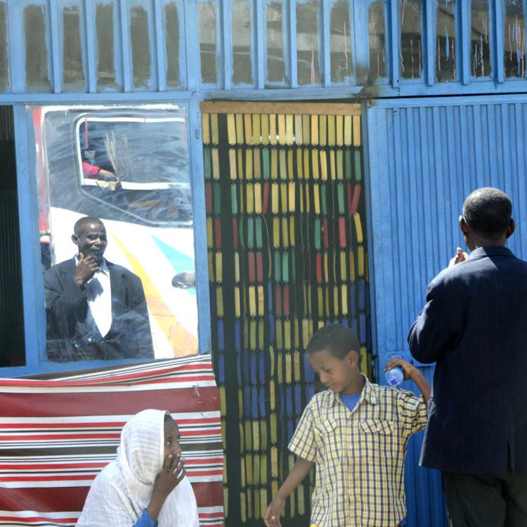 Smiling Woman at Bus Stop, Addis Ababa