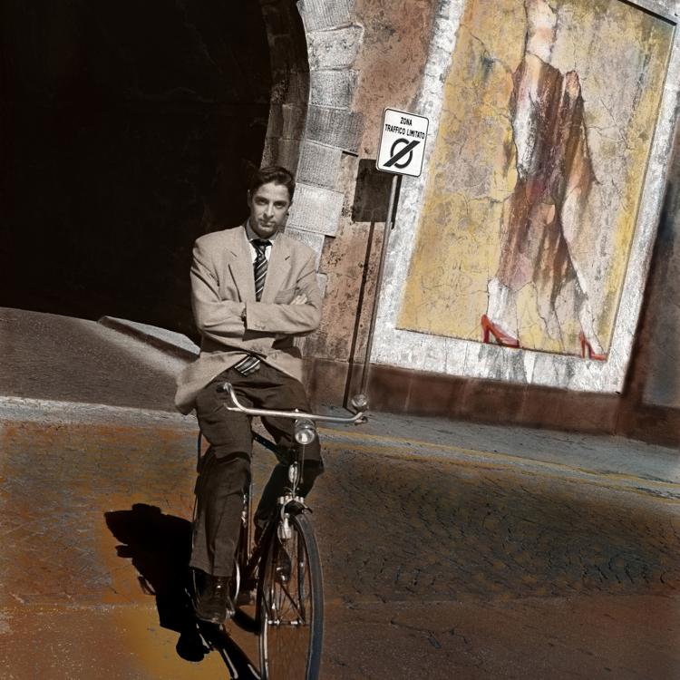 Lucca Italy  Man on Bicycle mural behind. Colored digital print